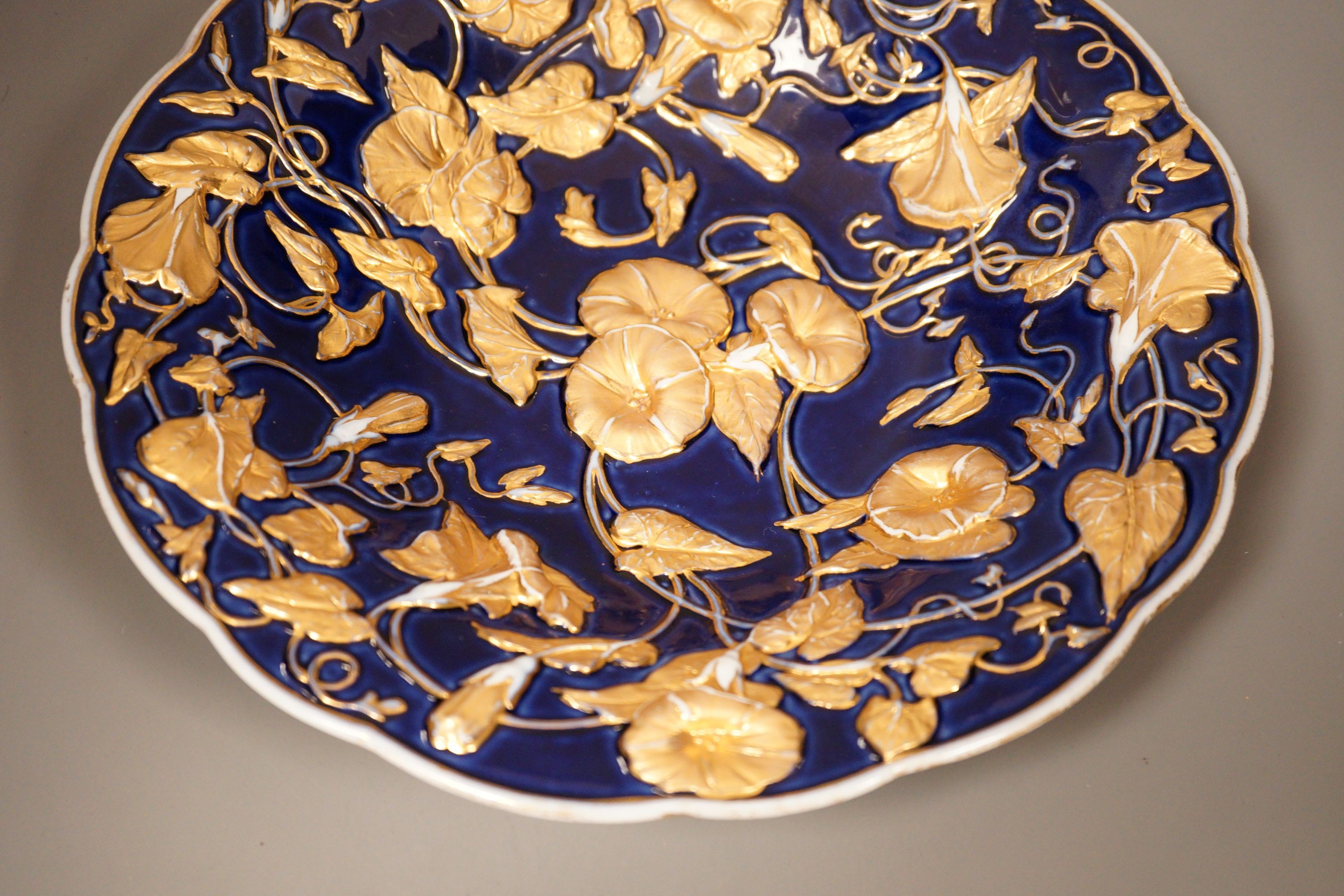 A late 19th century Meissen floral gilt and blue dish, 29cm
